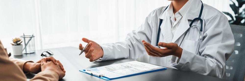 Medical specialists consulting with a patient at a healthcare centre in Doha.