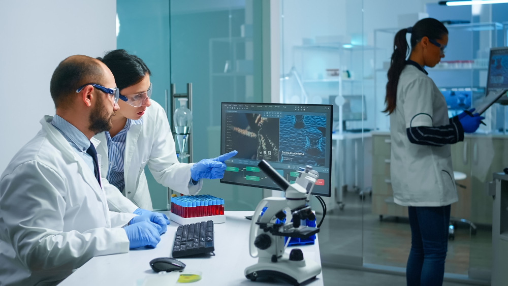 Laboratory technician examining a blood sample in a medical laboratory in Doha.