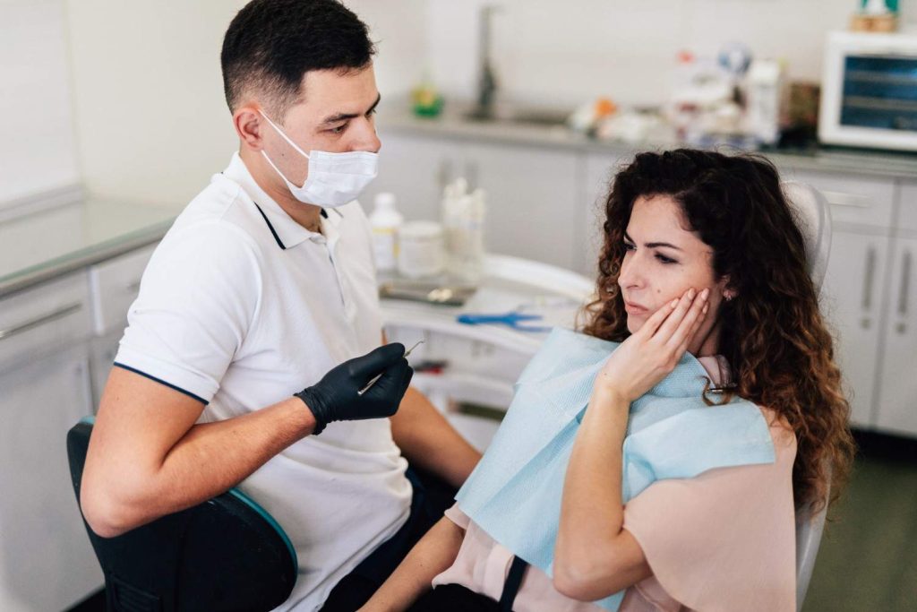 Bleeding gums treatment by a dentist in Qatar